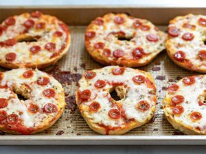 Pizza bagel on a sheet pan. 
