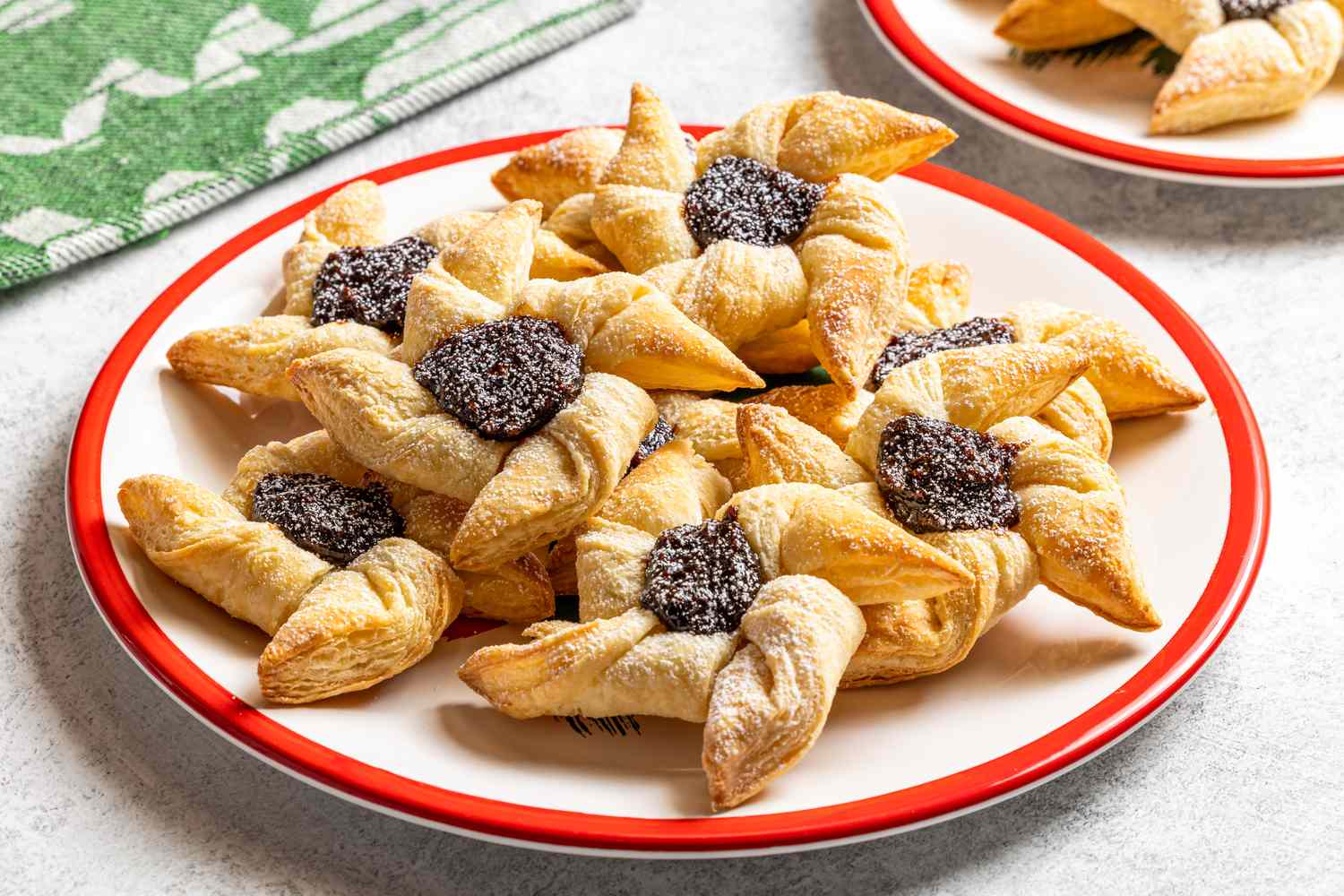 A plate of Finnish joulutortut pastries topped with fruit filling