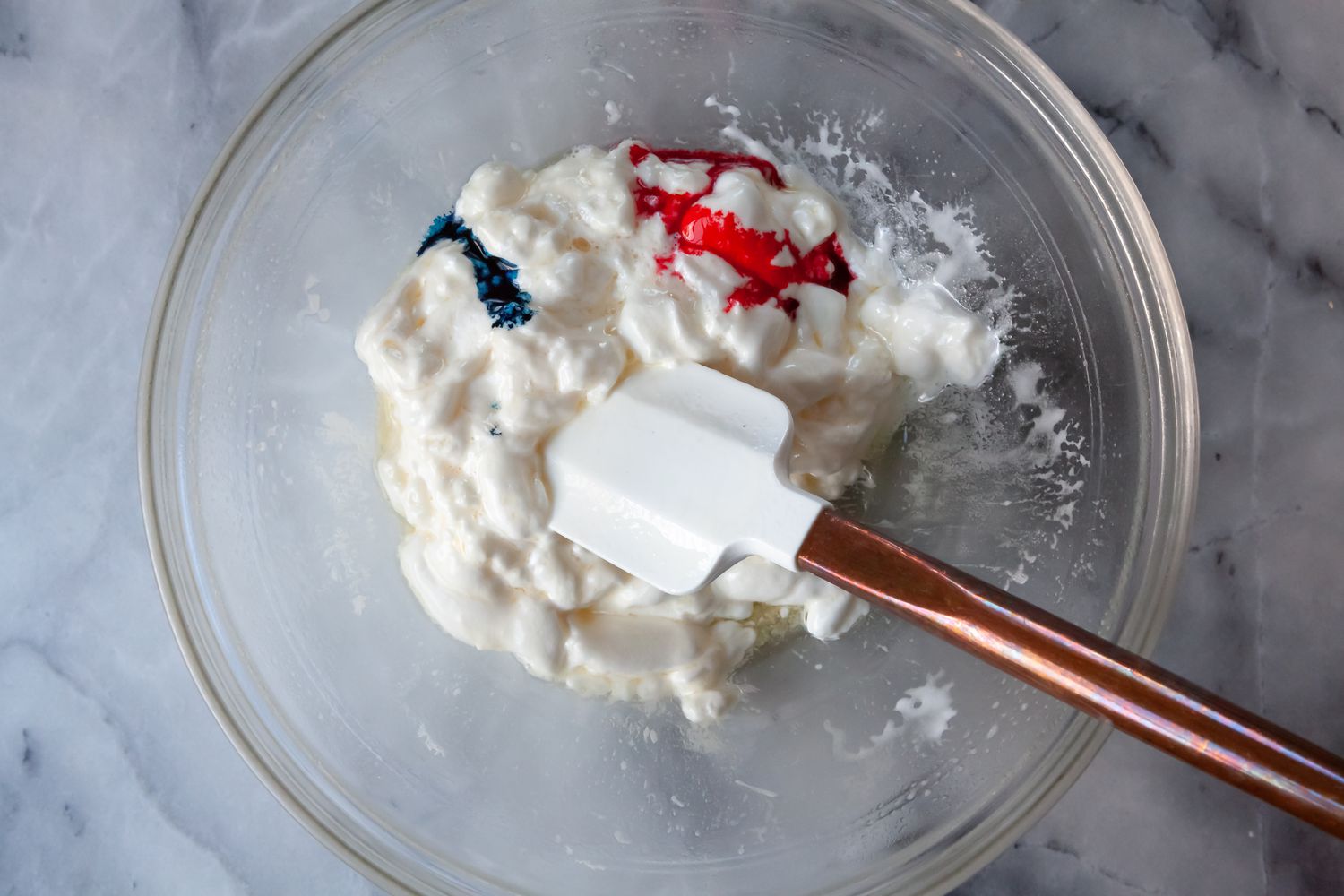 Red and Blue Food Coloring Added to Melted Marshmallows for Rainbow Rice Krispies Treats