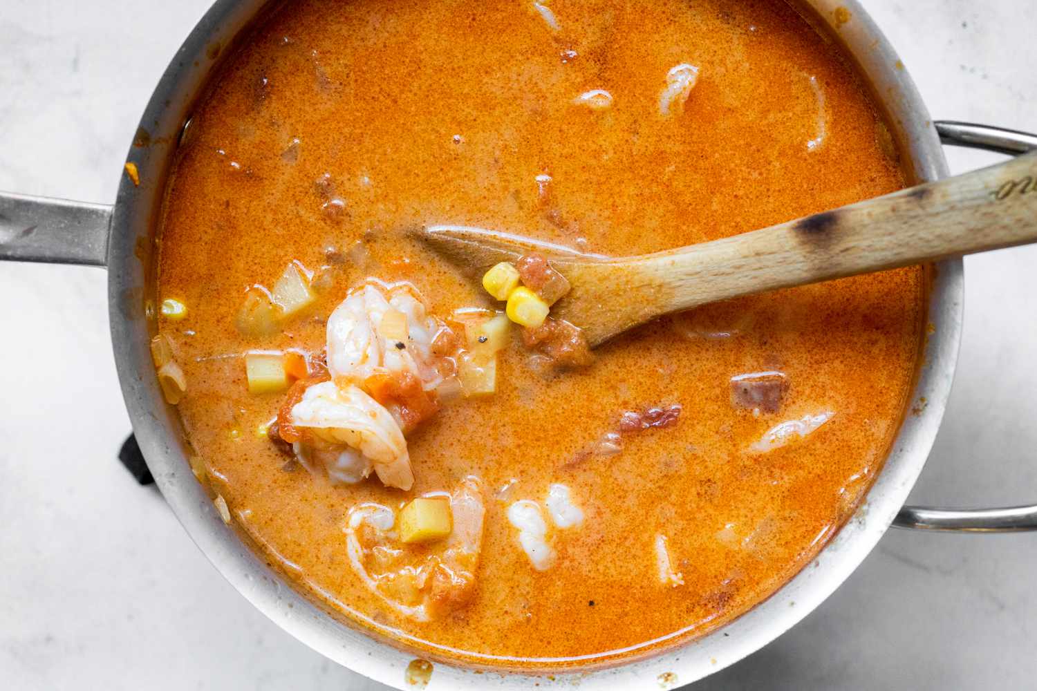 Shrimp and Half and Half Added to Pot of Chorizo and Shrimp Chowder Recipe