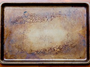 A well-used baking sheet with a dark brown patina