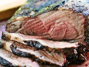 Grilled Butterflied Leg of Lamb sliced on a cutting board
