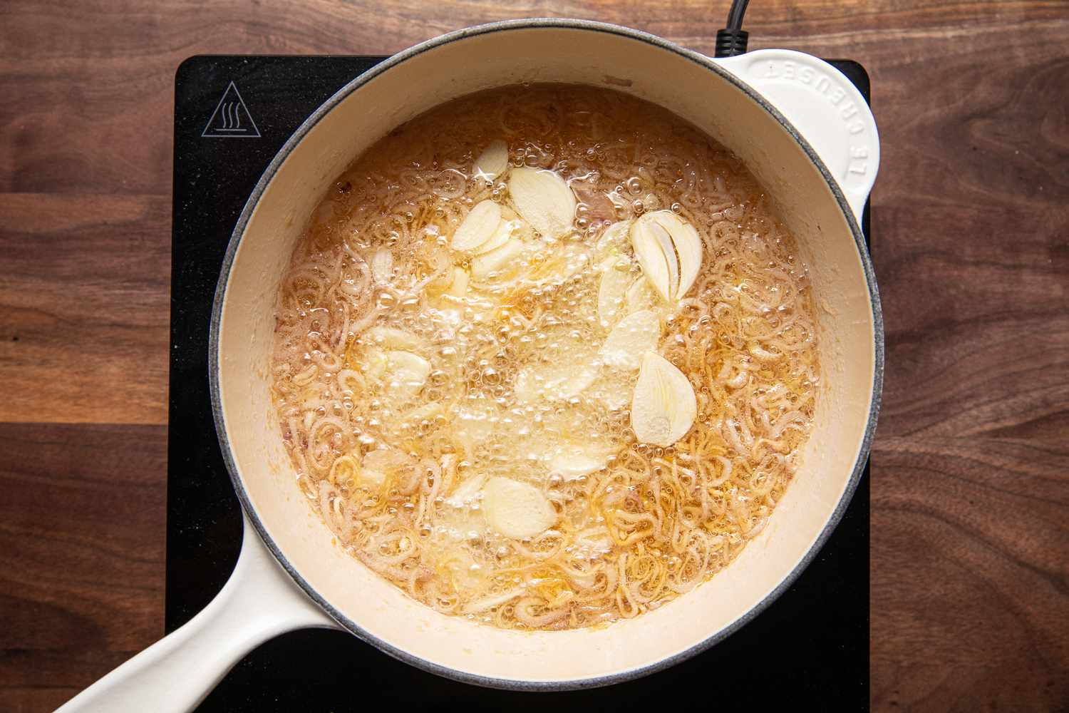 Sliced Garlic Added Pot of Oil With Shallots for Homemade Chili Crisp