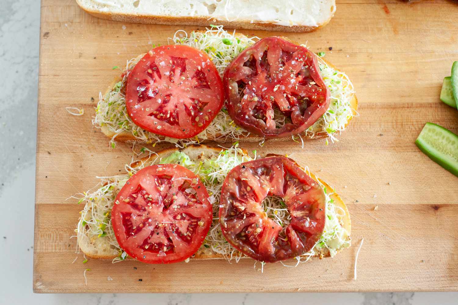 Sprouts and Tomatoes Added to Loaded Veggie Sandwiches