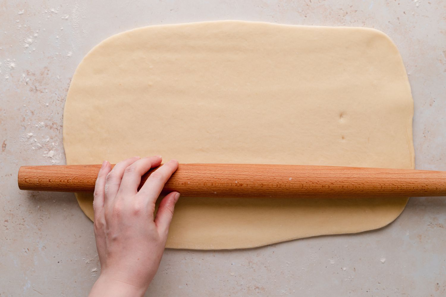 Rolling out chocolate loaf bread dough.