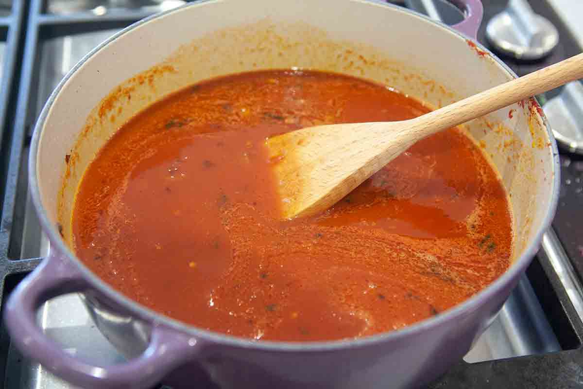 tomatoes added to pot for baked beans