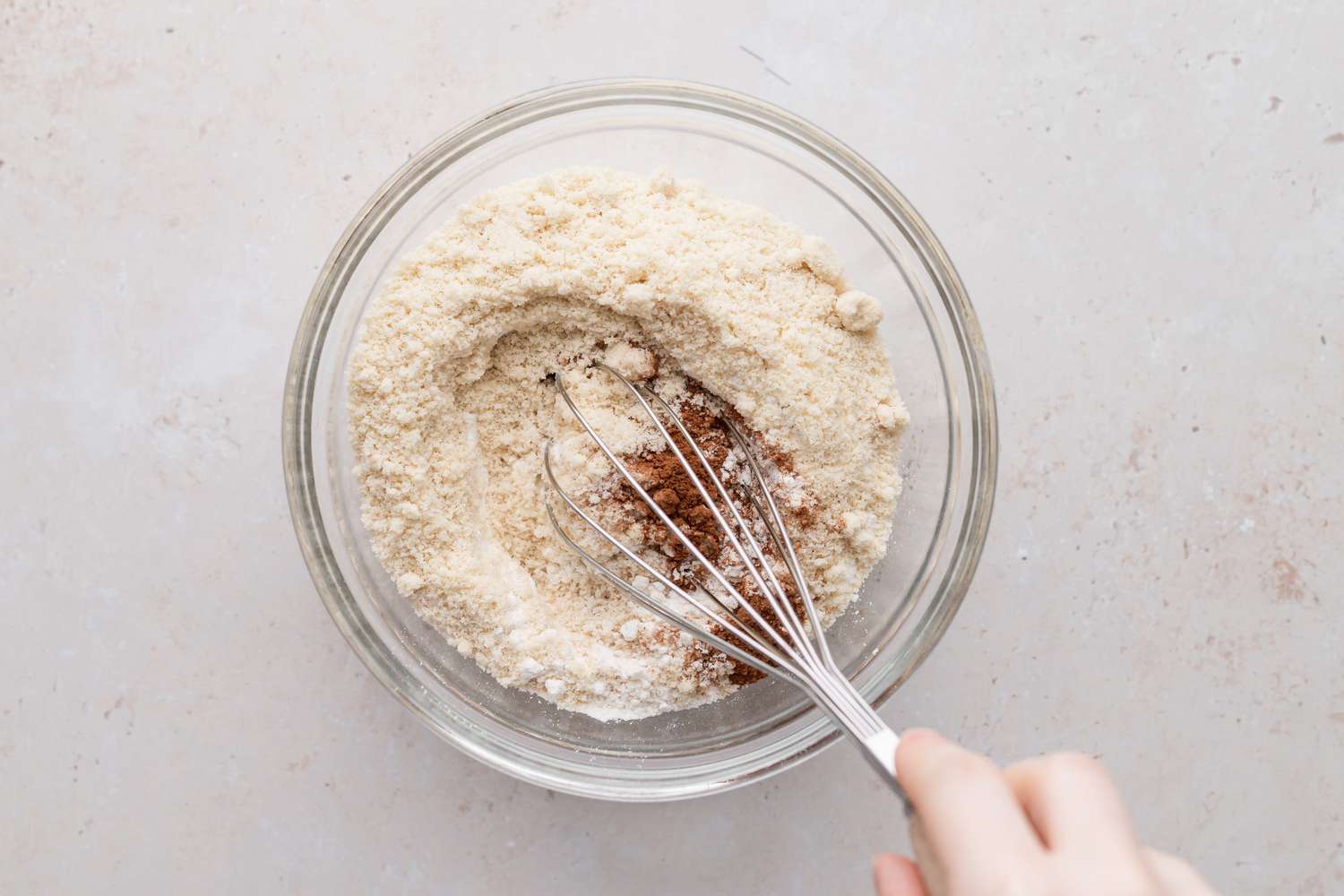 Whisking dry ingredients for jam filled sandwich cookies.