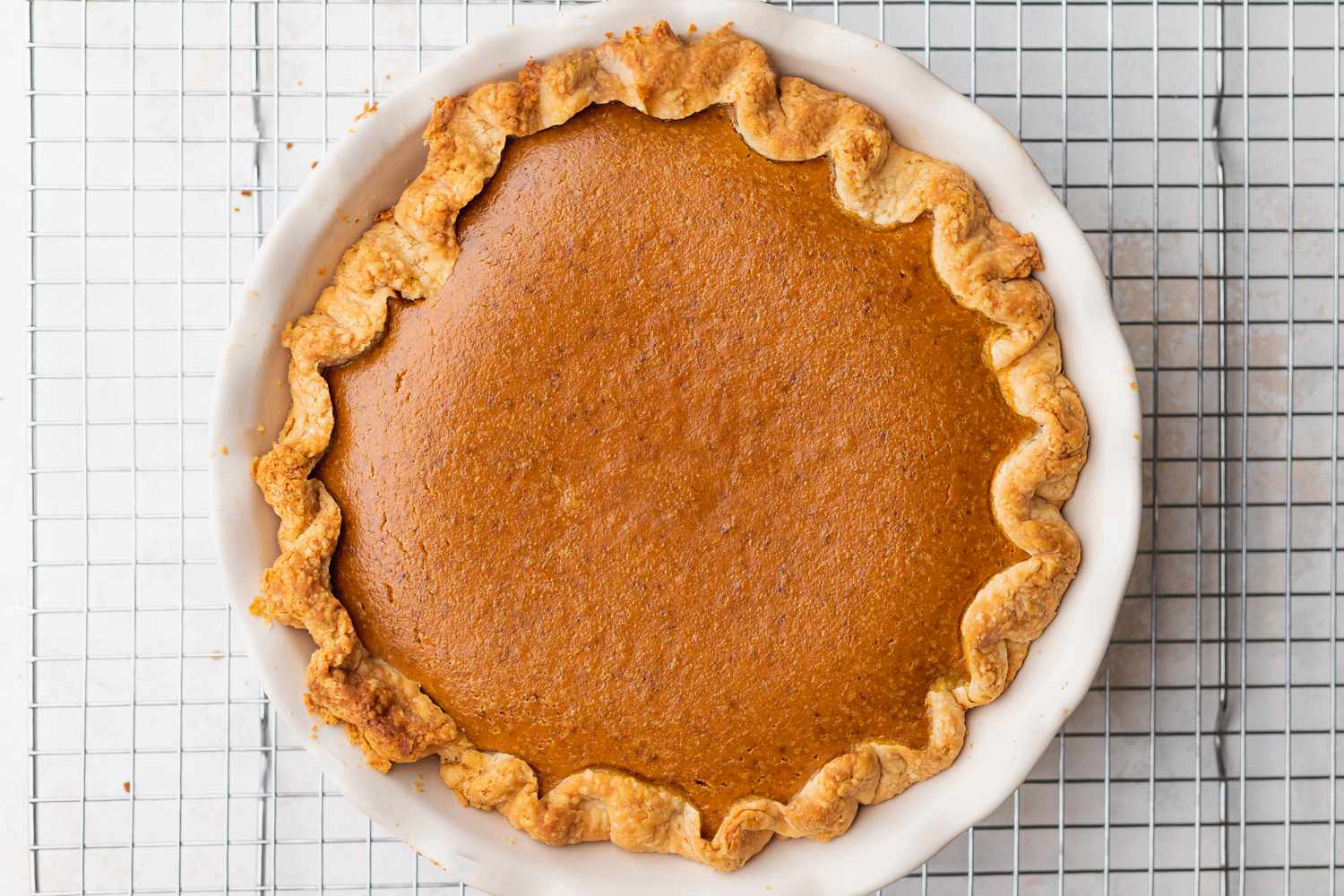 Baked Old Fashioned Homemade Pumpkin Pie on a Cooling Rack