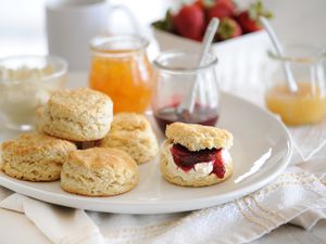 English-Style Scones on a tray with jam.