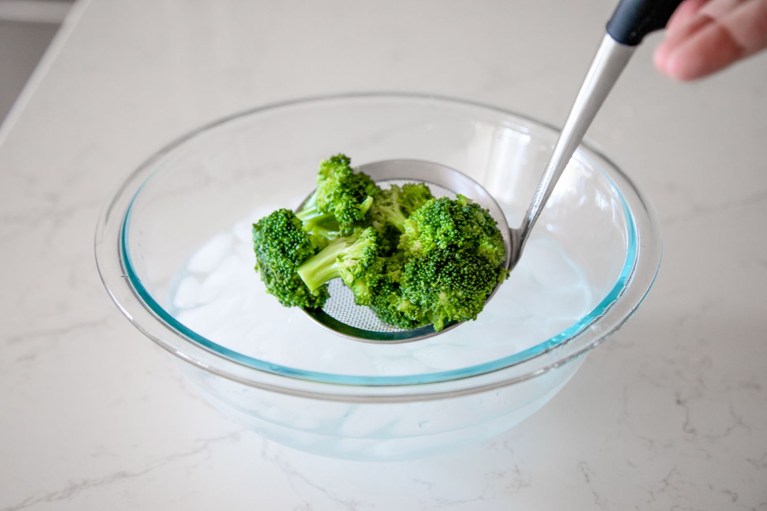 Blanched Broccoli Removed Using a Mesh Spoon for How to Blanch Broccoli