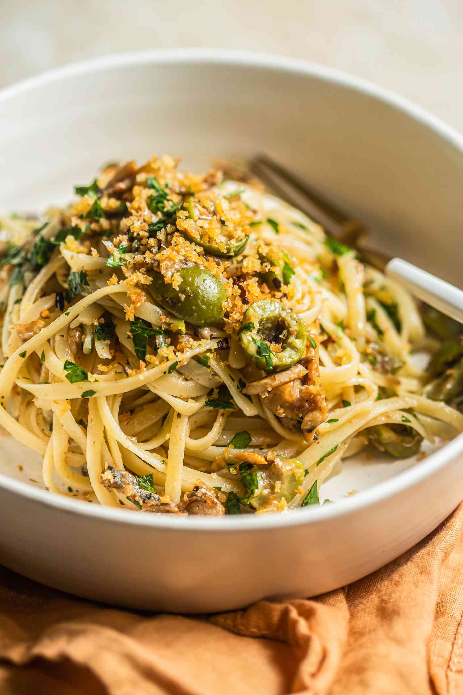 Lemony Sardine Pasta Topped With Toasted Breadcrumbs in a Bowl