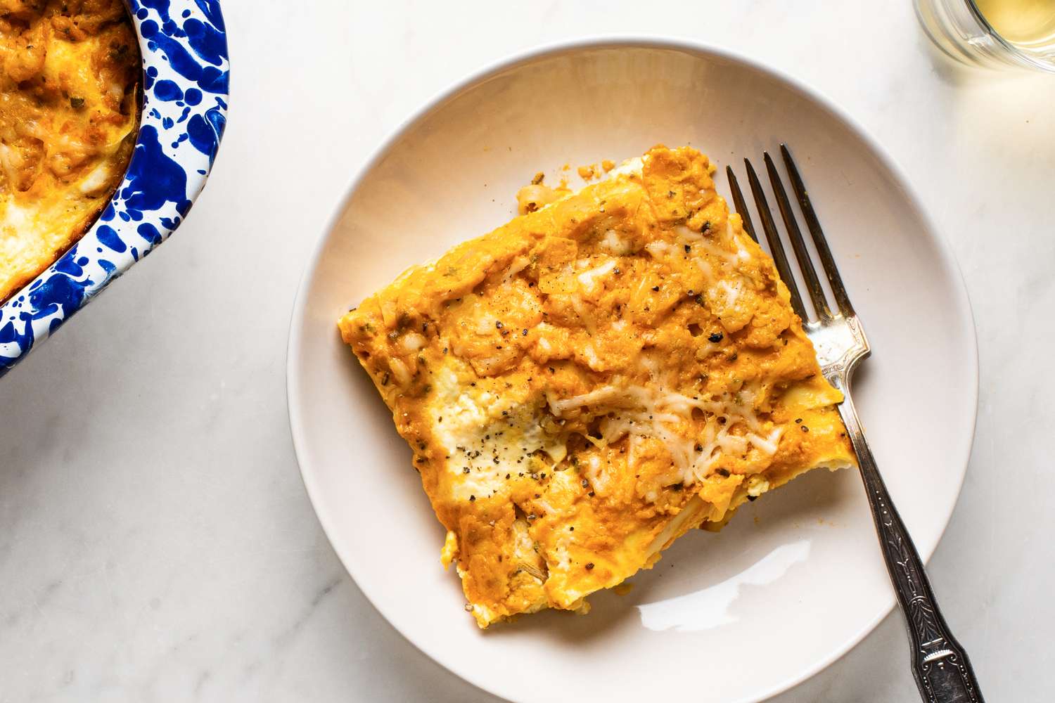 one serving of Easy Pumpkin Lasagna on a dish with a fork