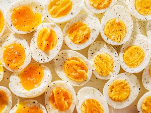 boiled egg halves topped with salt and pepper