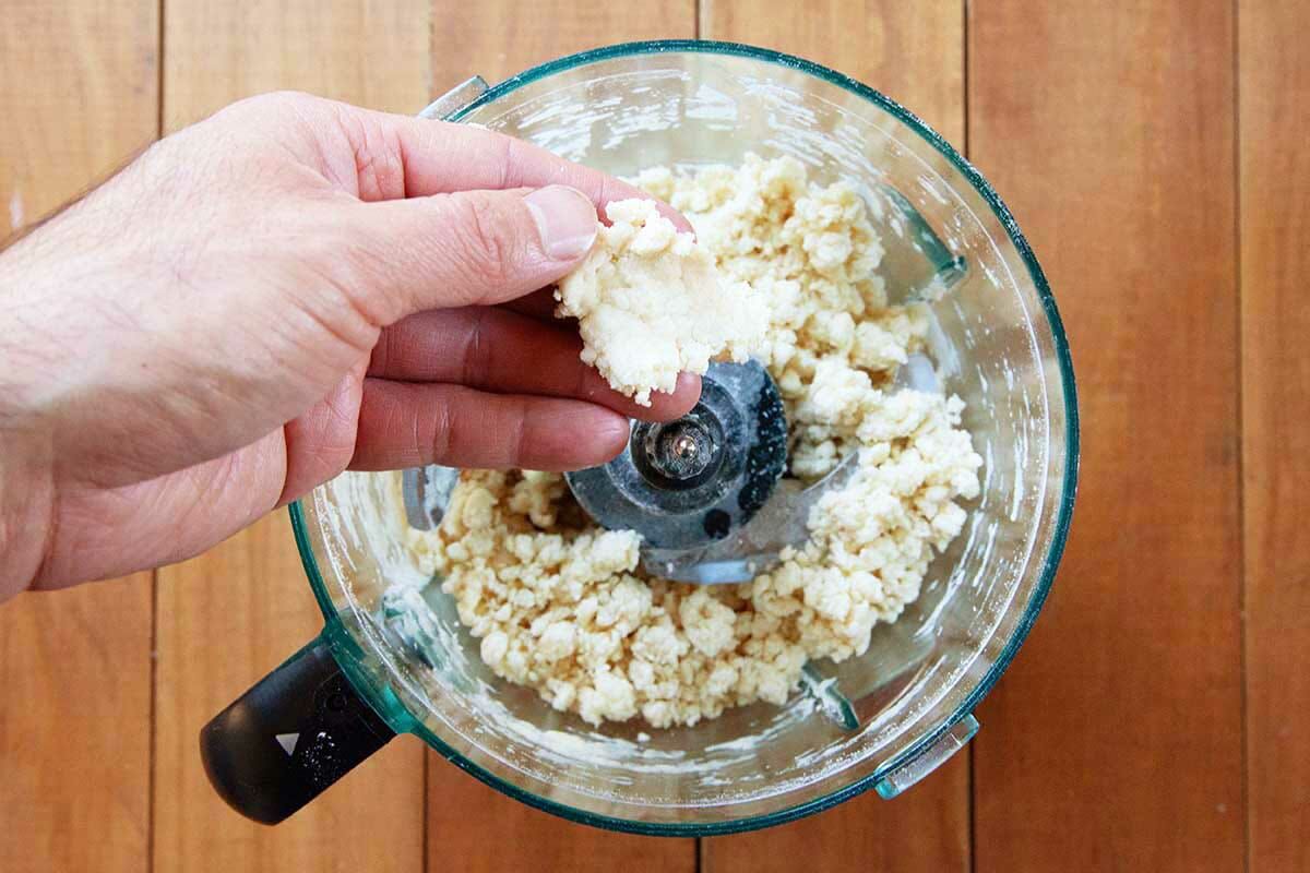 View of the pie crust dough inside the food processor to make the best shoofly pie.