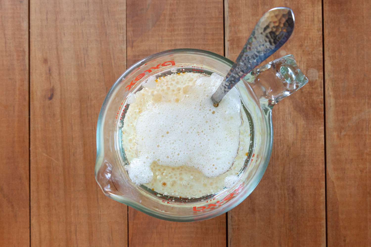 Liquid ingredients being mixed to make a fluffy white cake that tastes just like box mix.