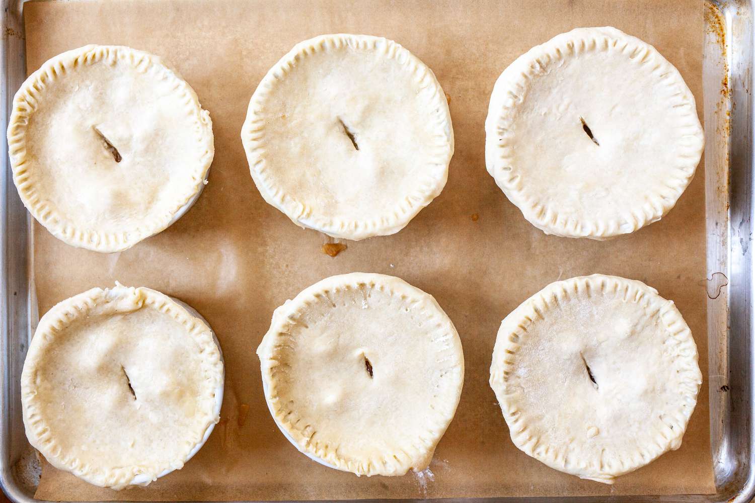 Individual cajun turkey pies topped with a crust.