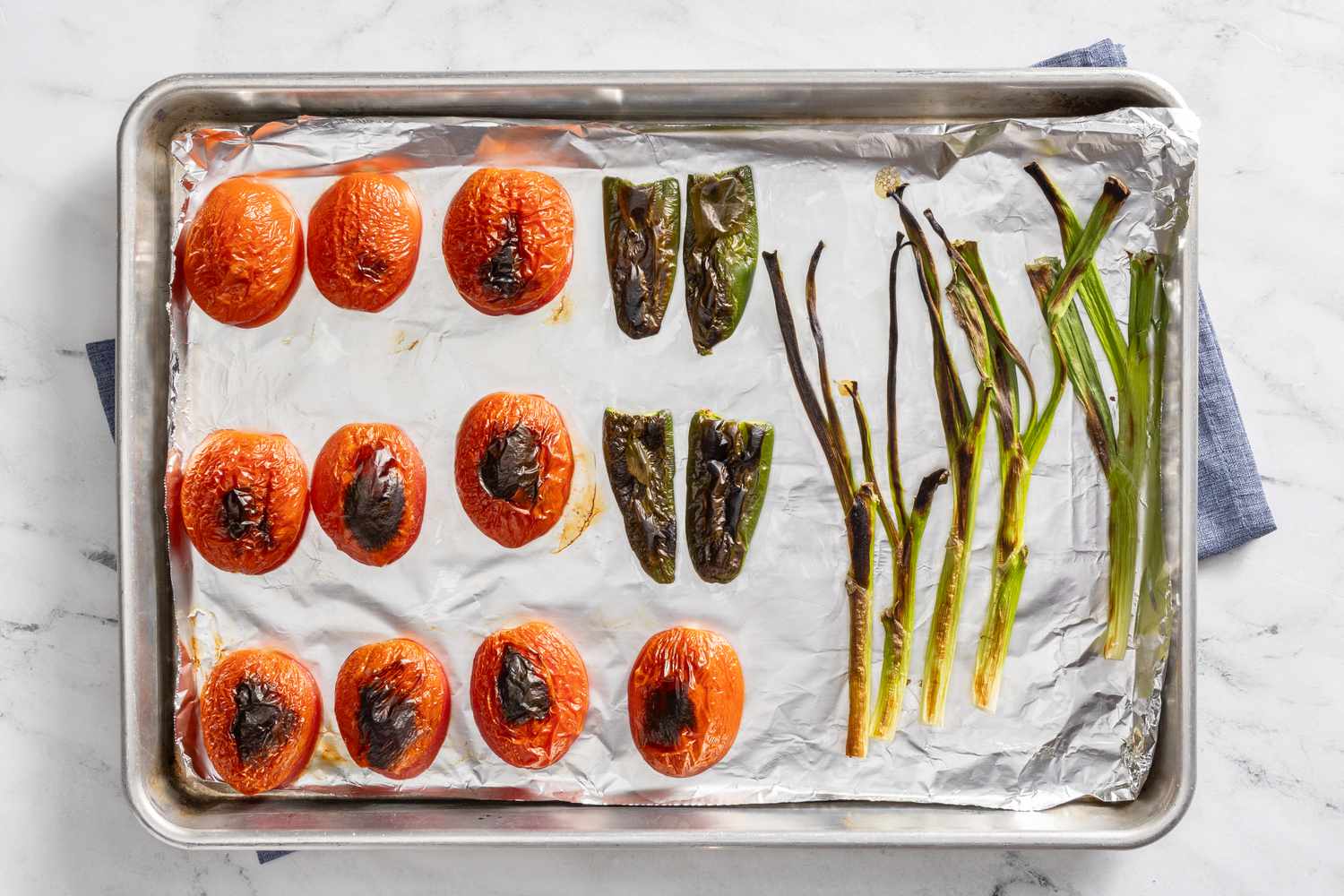 roasted vegetables on baking sheet for borracho beans (frijoles beans) recipe