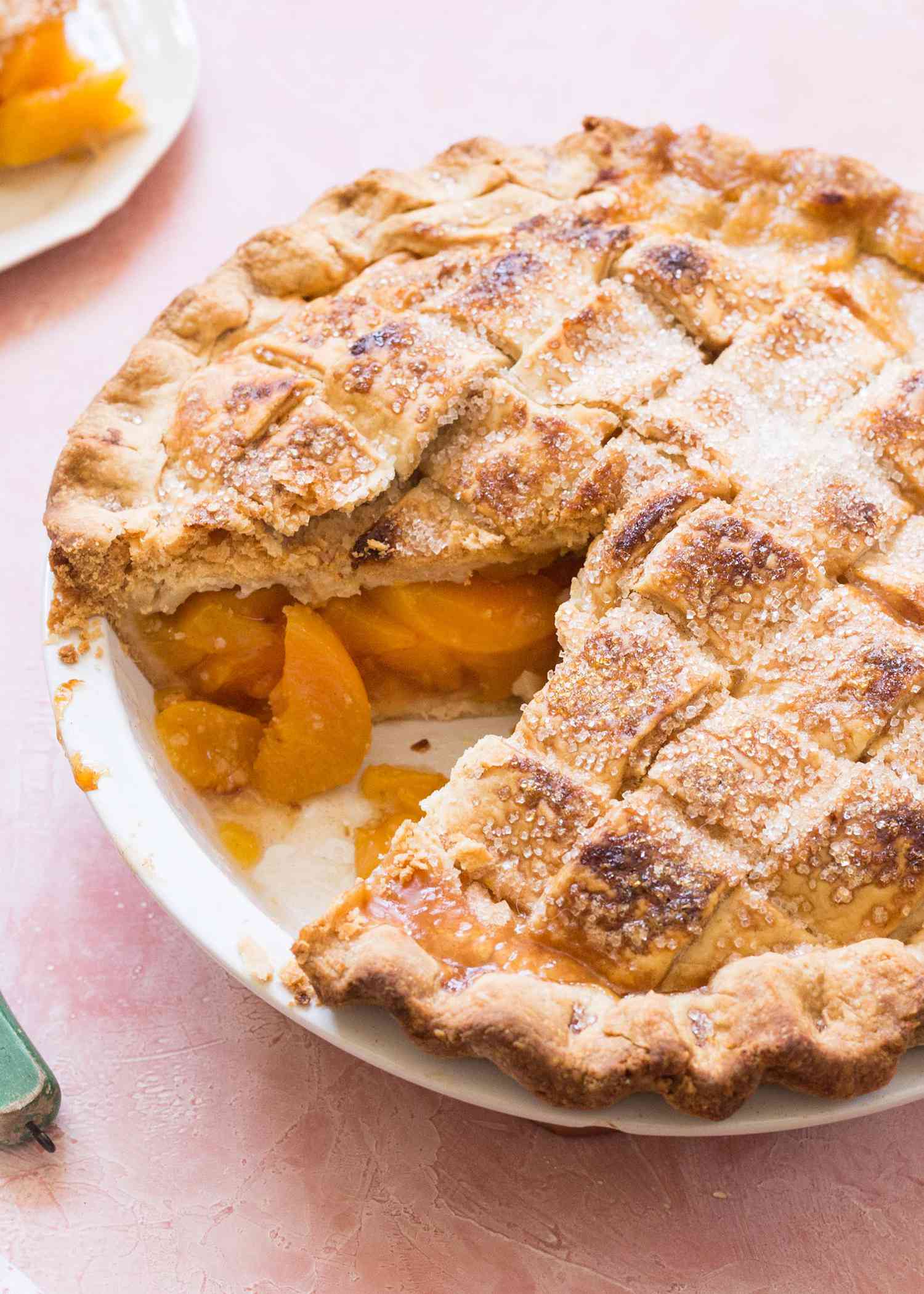 Homemade Peach Pie with one slice removed