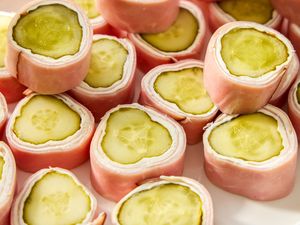 Slices of pickle cream cheese rollups with ham