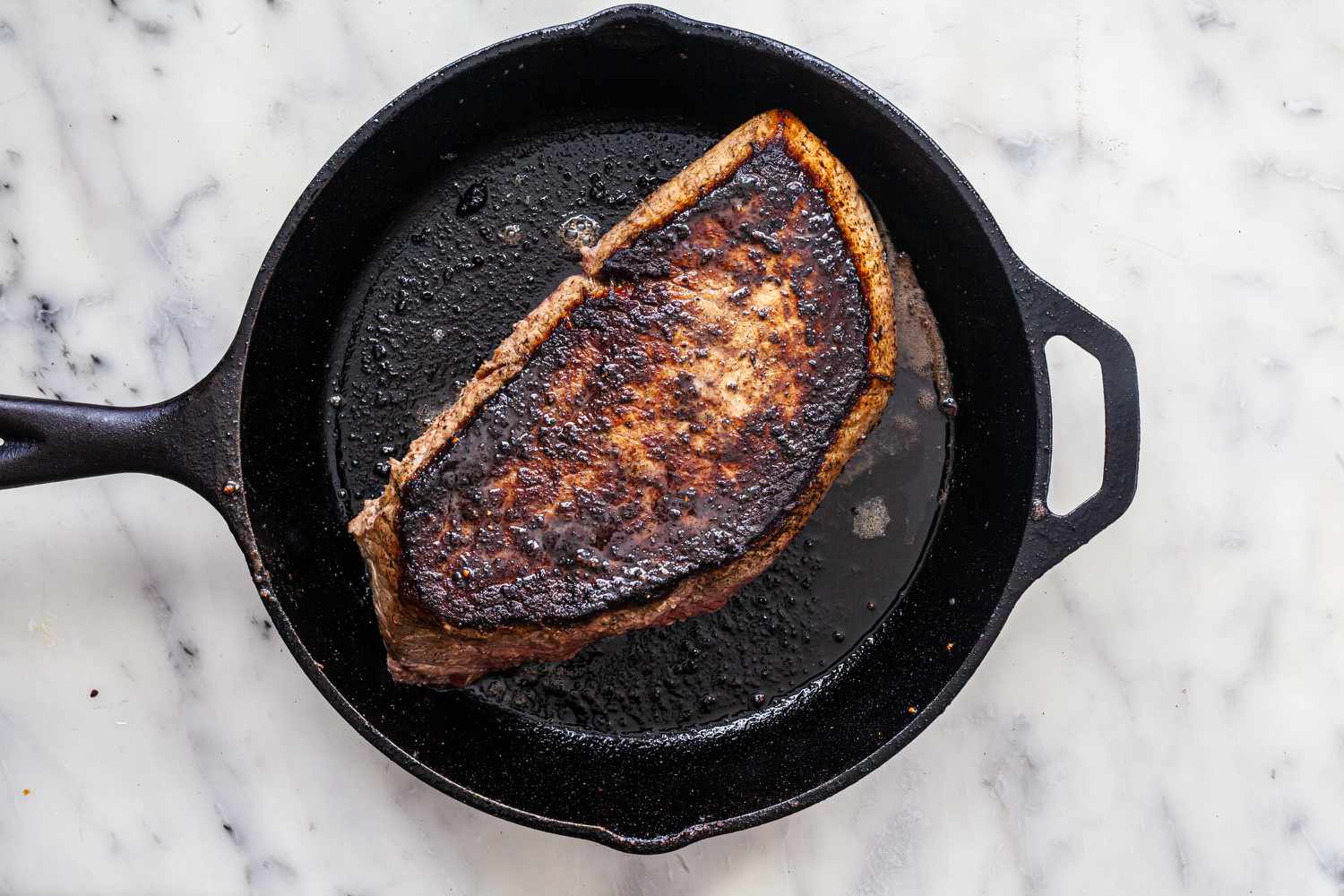 Cooking steak in cast iron.
