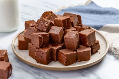 Microwave Fudge cut into squares and piled on a platter