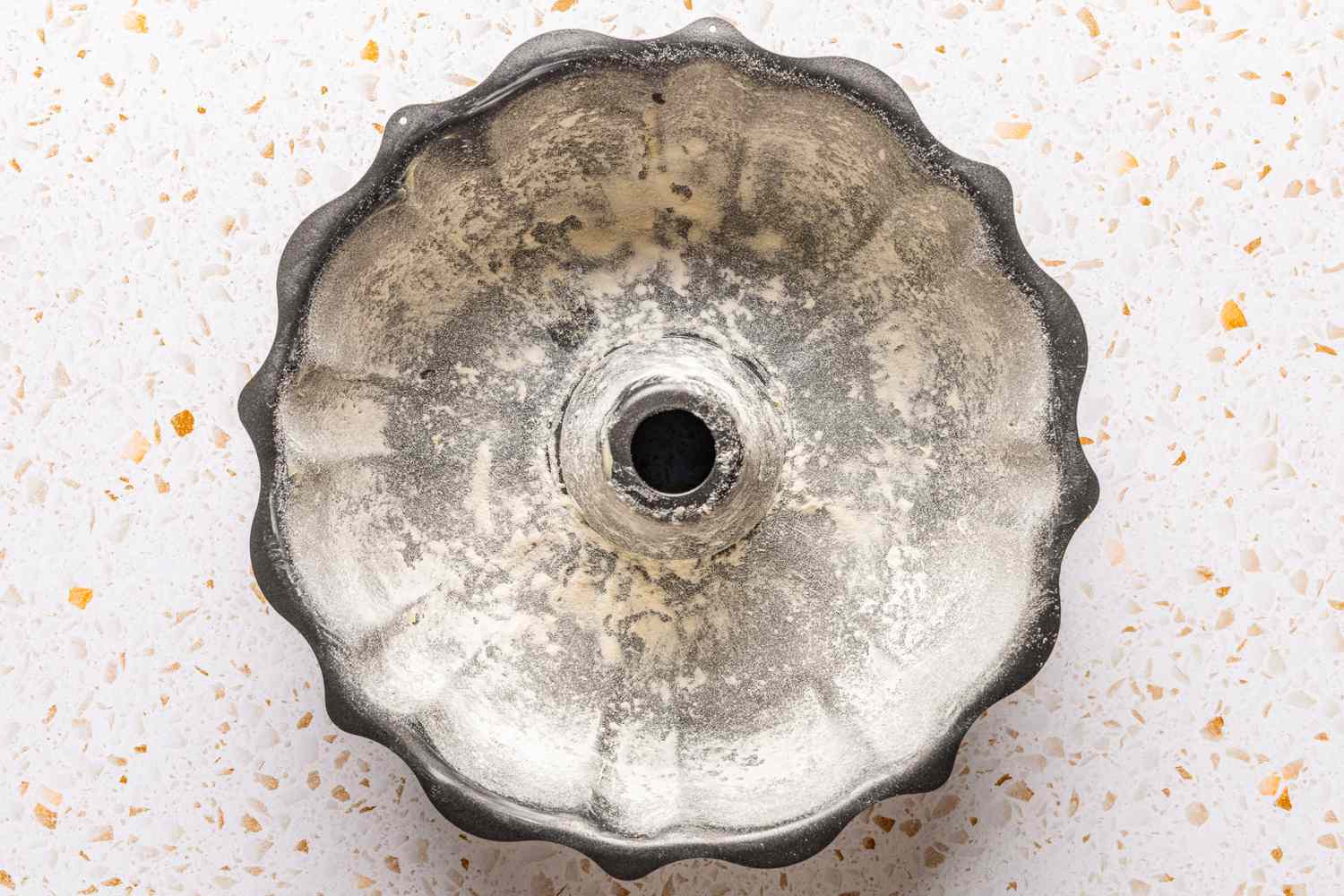 bundt cake pan covered in butter and flour for ciambellone recipe