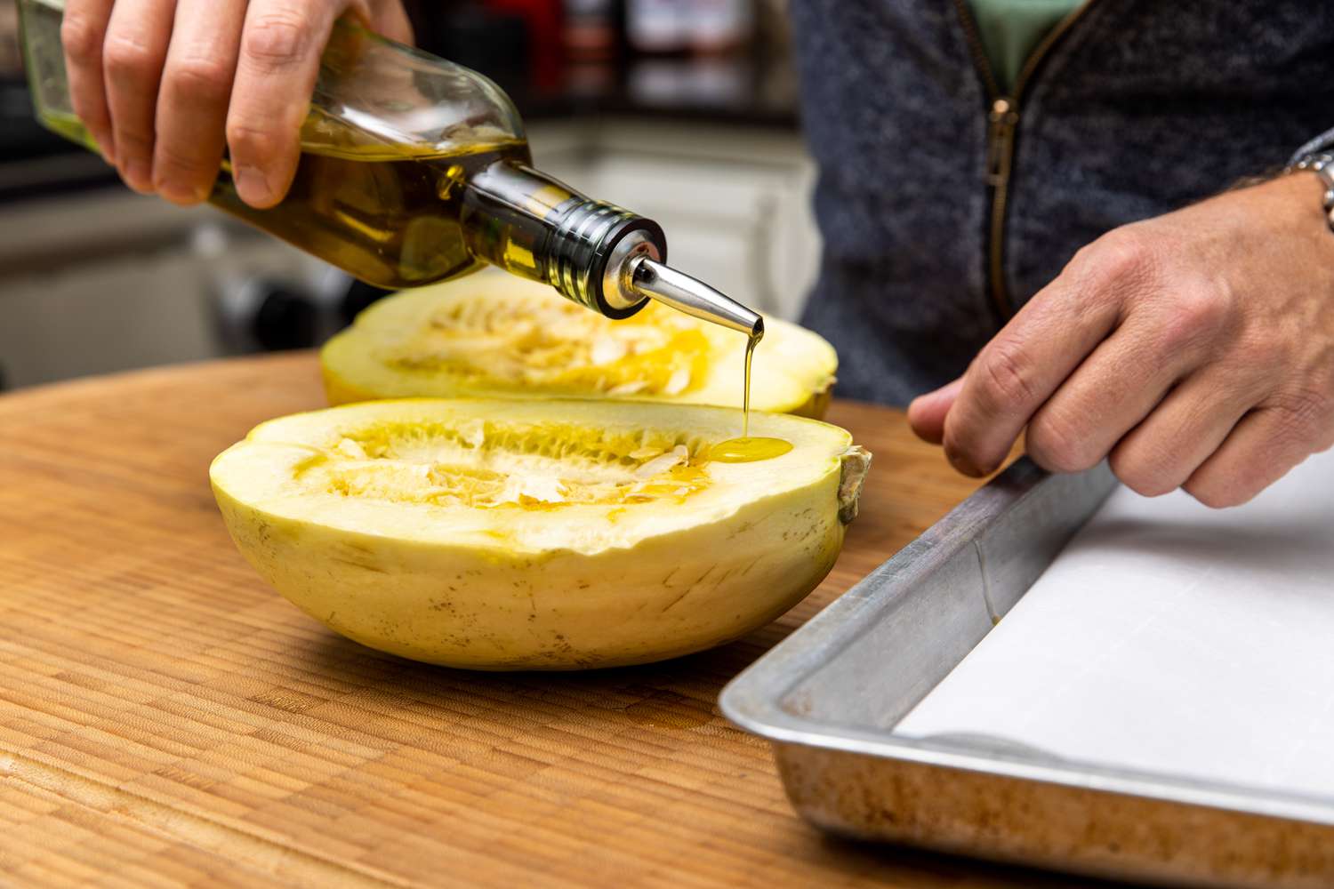 Olive Oil Drizzled onto Flesh Side of Halved Spaghetti Squash for Spaghetti Squash Soup Recipe