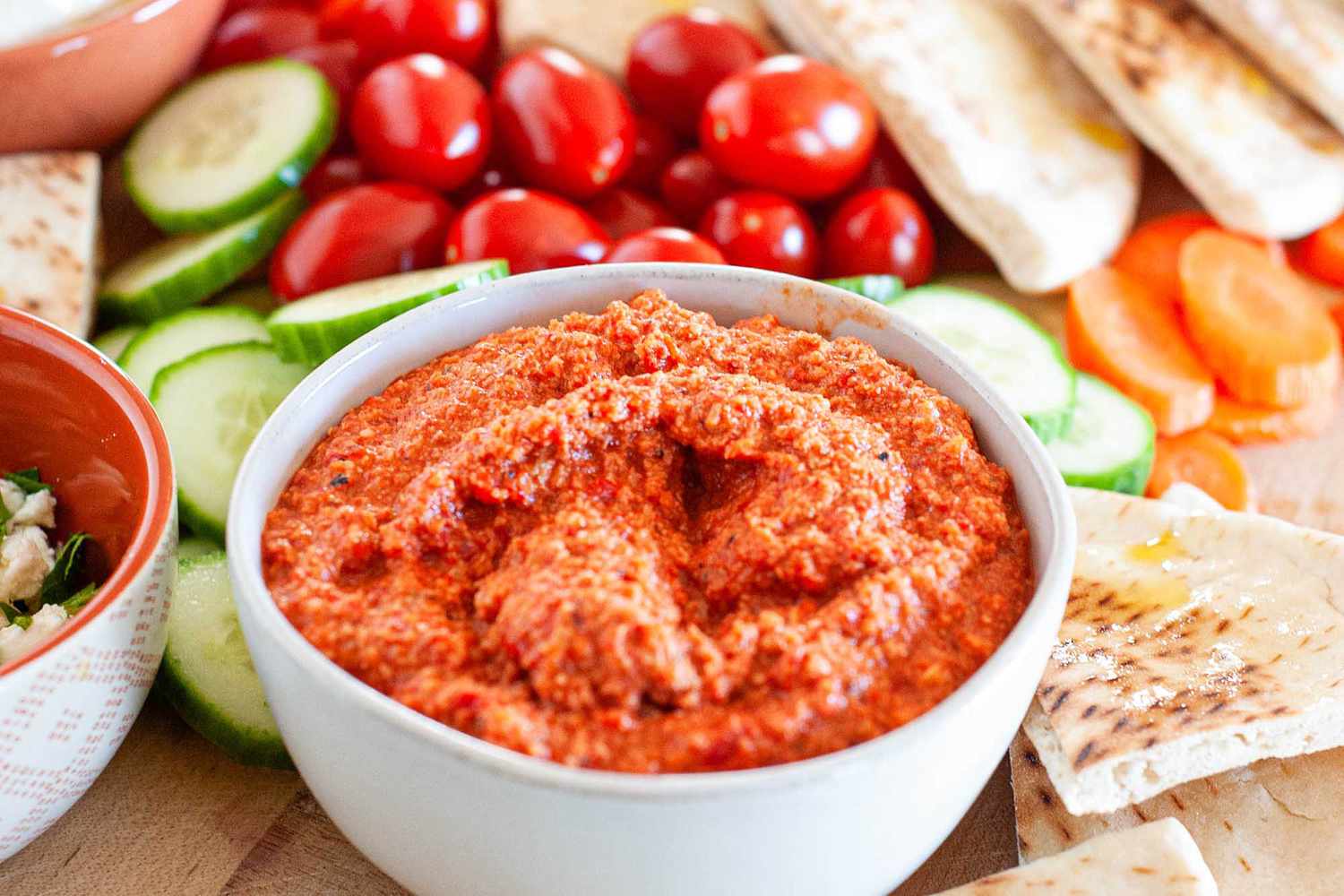 Muhammara dip with bread and vegetables