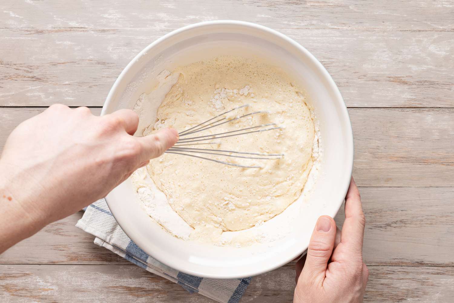 Wet ingredients added to the bowl and whisked together to make Pannenkoeken (Dutch Pancakes) batter
