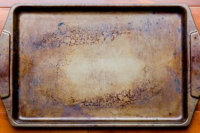 A well-used baking sheet with a dark brown patina