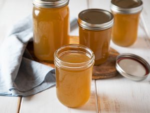 Mason jars filled with beef stock.