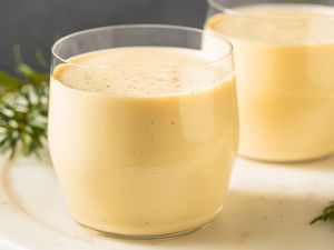 Two glasses of eggnog on a table