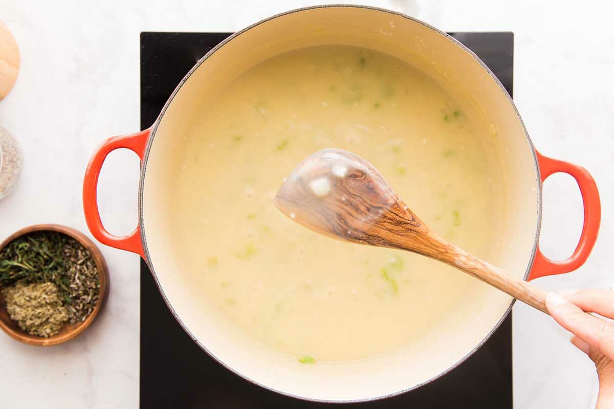 The filling is thickening in a dutch oven for the best Chicken Pot Pie.
