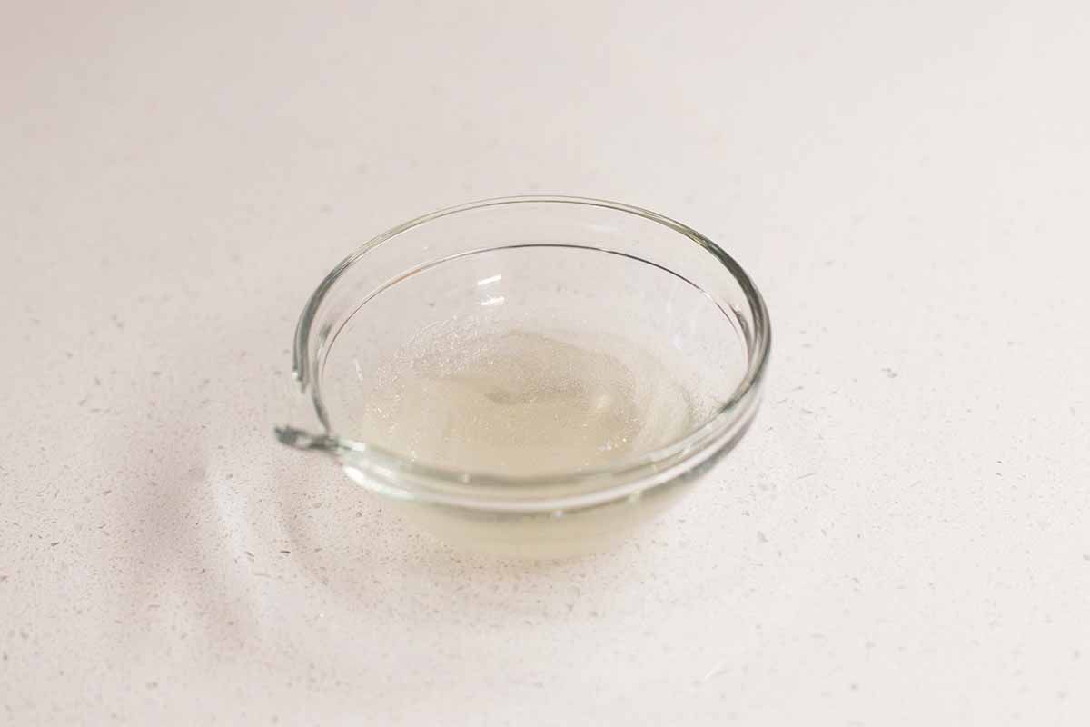 Melted gelatin in a small glass bowl.