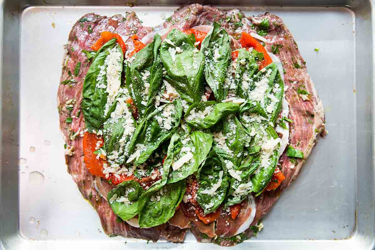 flank steak layered with prosciutto bell peppers basil for stuffing