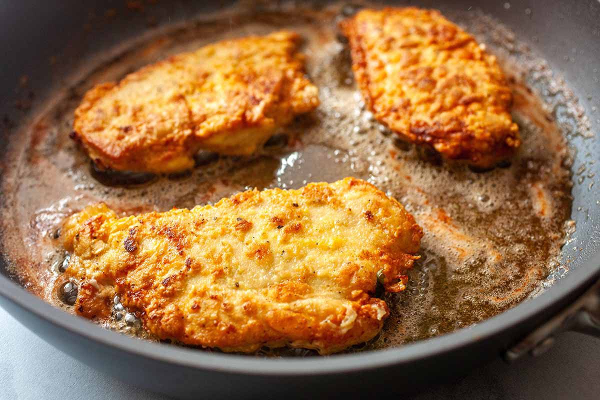 Easy Chicken Piccata with Pasta fry the chicken