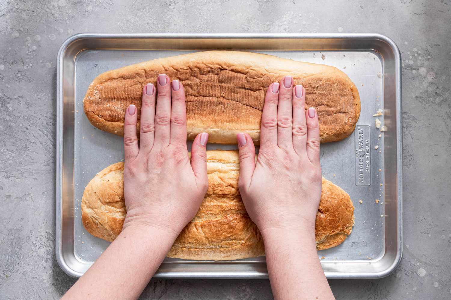 Sliced Bread Pressed and Flattened Onto the Baking Sheet (Cut Side Down) for French Bread Pizza