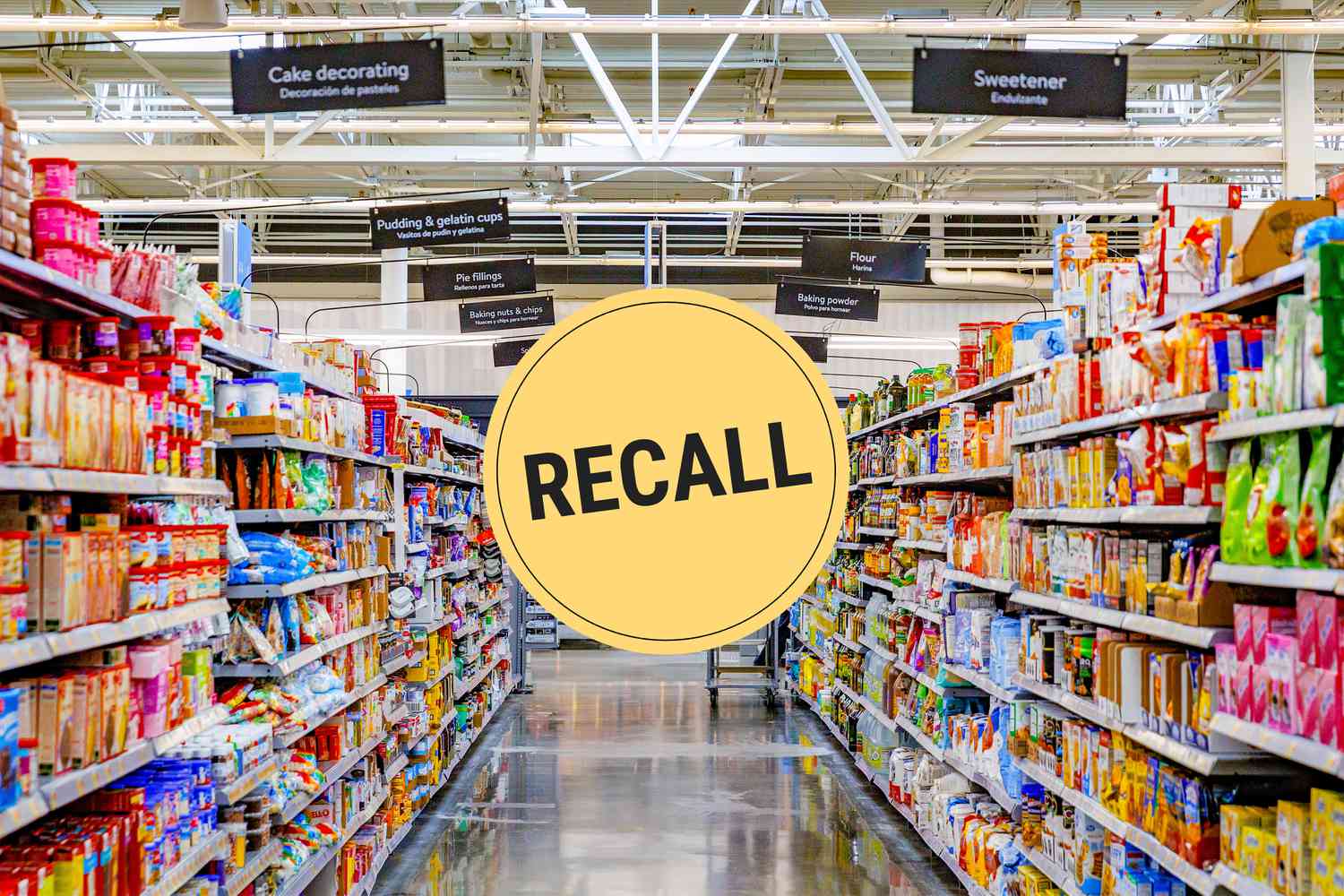 Looking down a grocery store aisle. A "recall" badge is superimposed over the center of the photo.