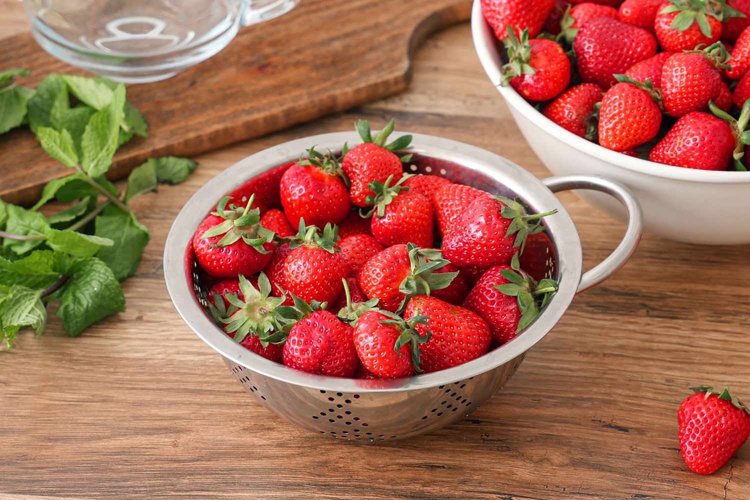 strawberries in a metal strainer