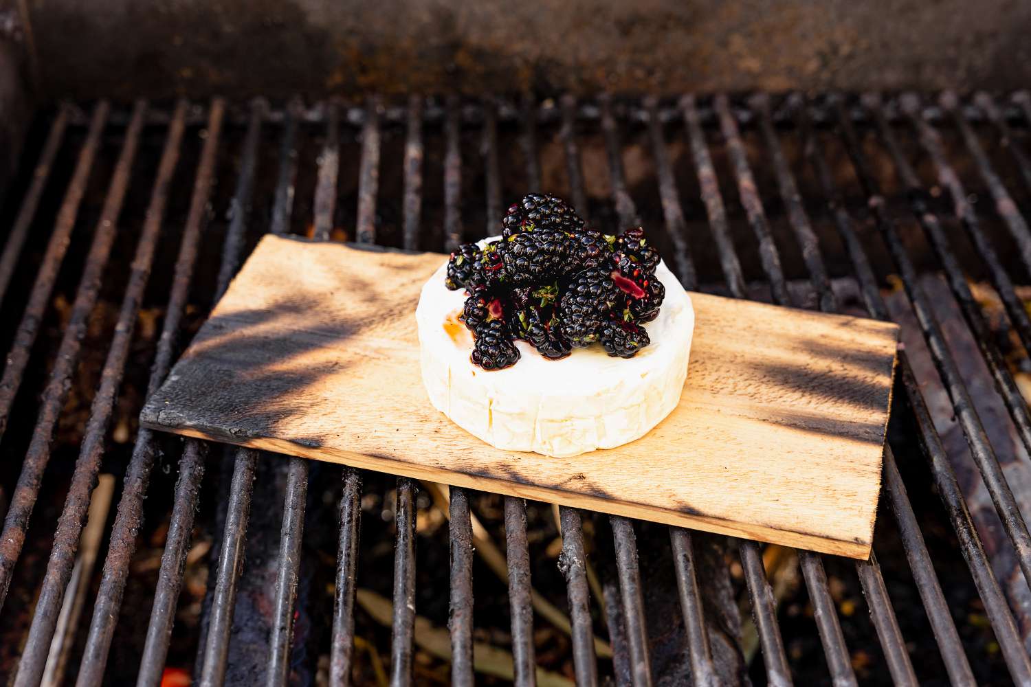 Brie Added to Toasted Cedar Plank and Topped With Blackberry Topping