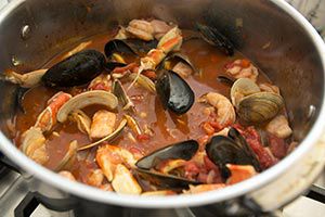 pot full of ciappino seafood stew