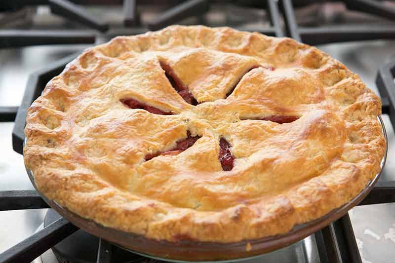 bake the strawberry rhubarb pie until the filling is bubbly