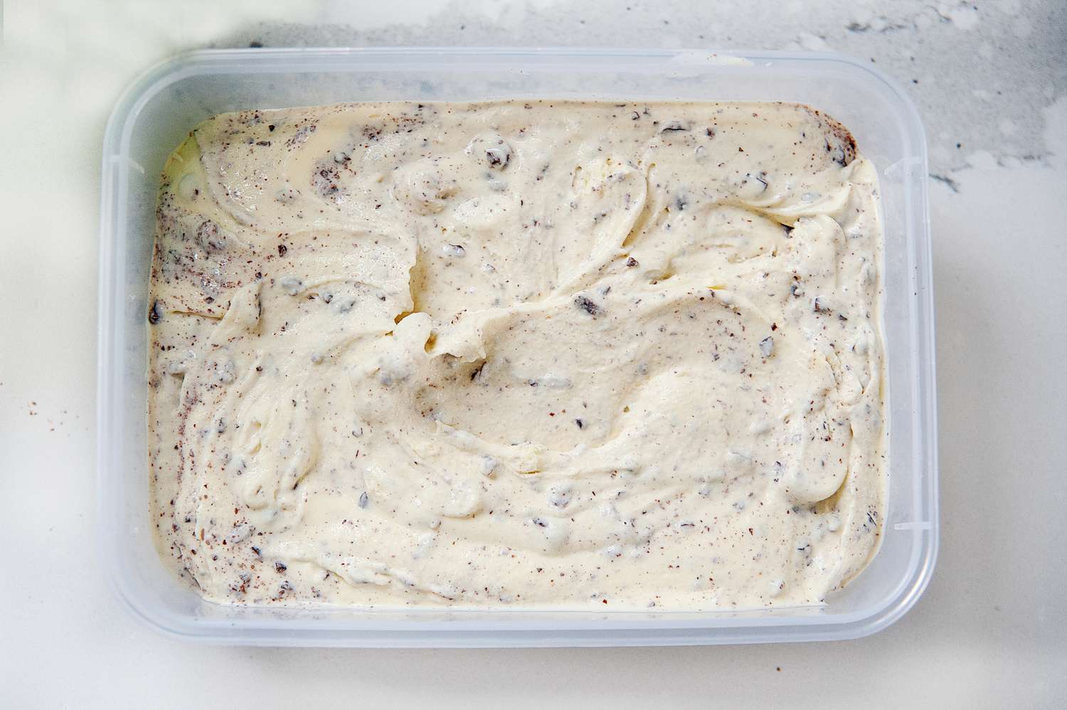 Mint ice cream in a freezer safe container.