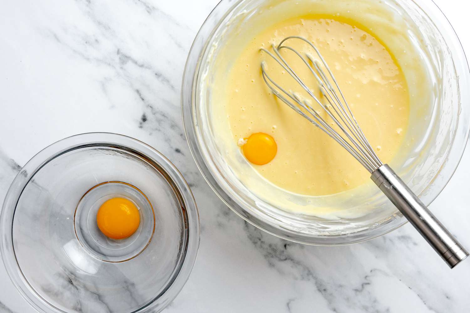 Egg Yolks Whisked Into Cream Cheese Mixture One by One