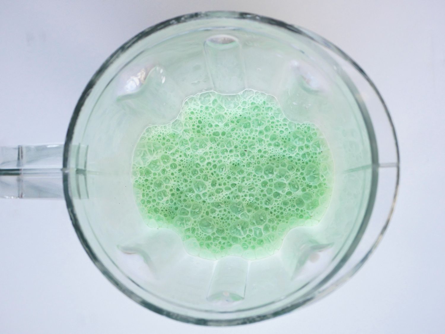 A blender with green colored cream to make a McDonald’s Shamrock Shake.