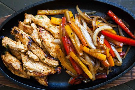 Chicken Fajitas resting in a cast iron platter