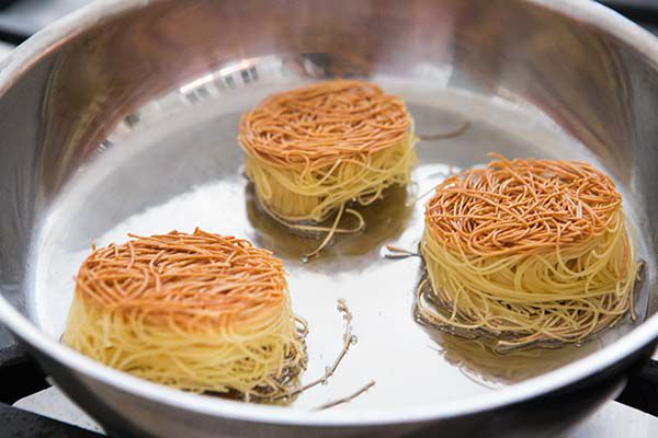 Browned angel hair nests for sopa seca de fideo