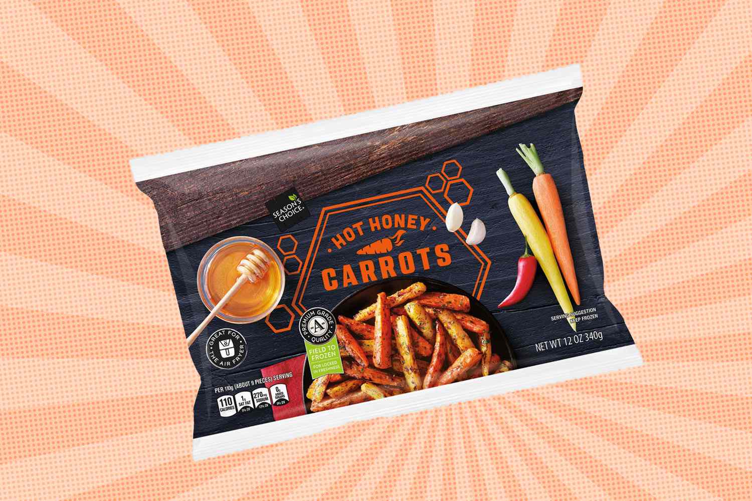 A package of Aldi Hot Honey Carrots showcasing roasted carrots and ingredients such as honey and chili on the packaging design