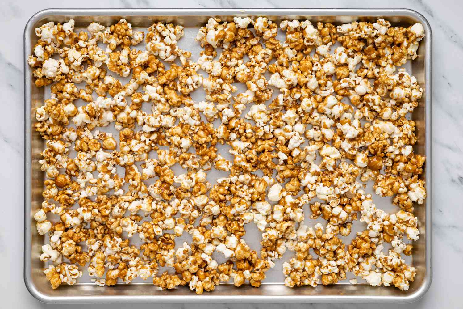 caramel corn on baking sheet