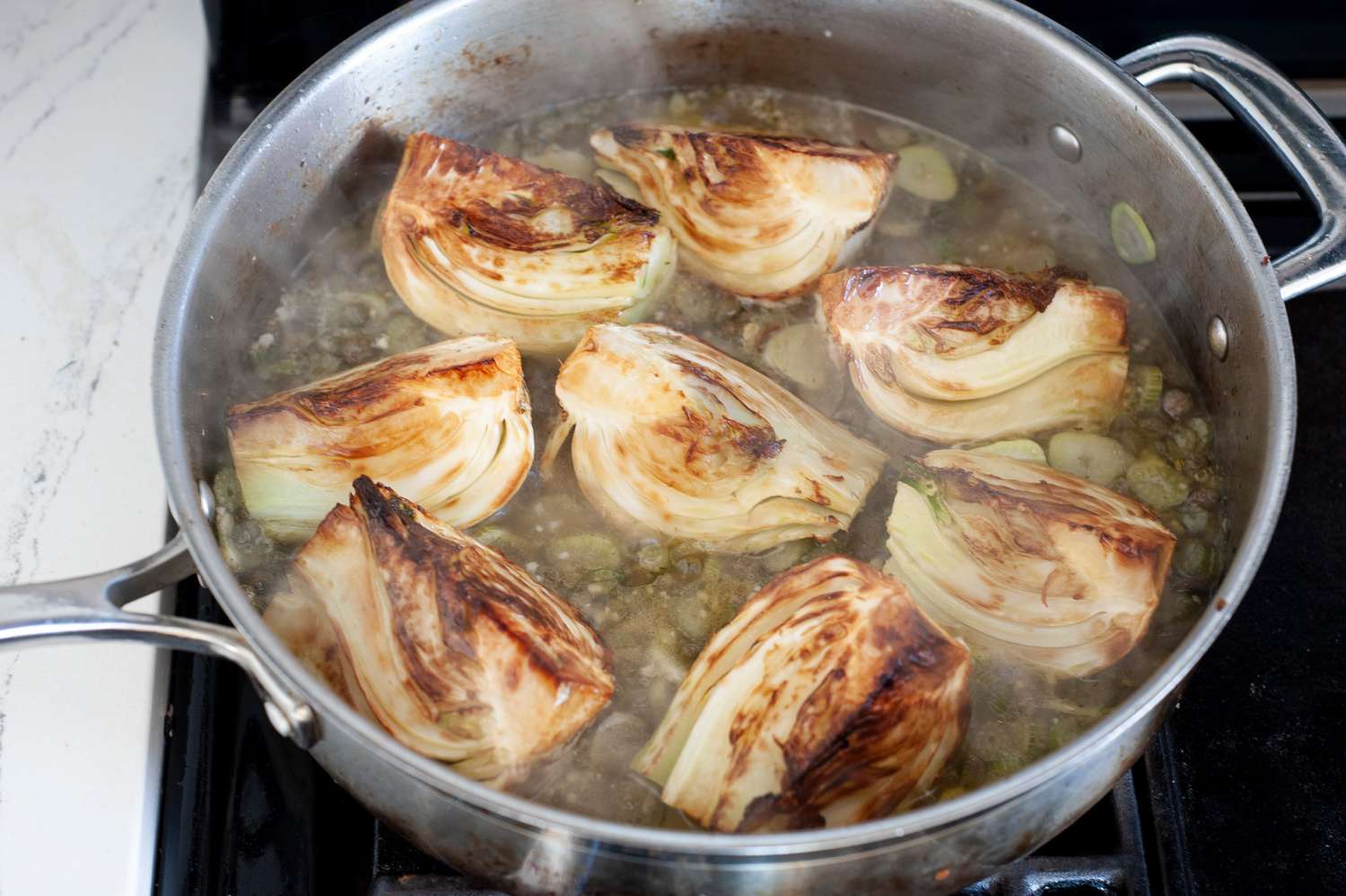 Tuck the fennel bulbs back into the skillet.